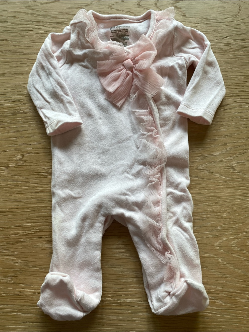 First Impressions Pale Pink Ruffle Footed One-Piece with Bow